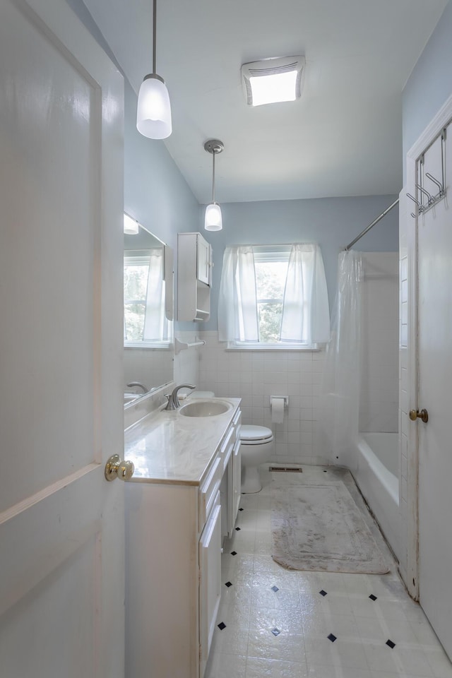 105 Joyce Ave, Red Bank, TN 37415 - bathroom featuring vanity, shower / bathtub combination with curtain, and tile patterned flooring