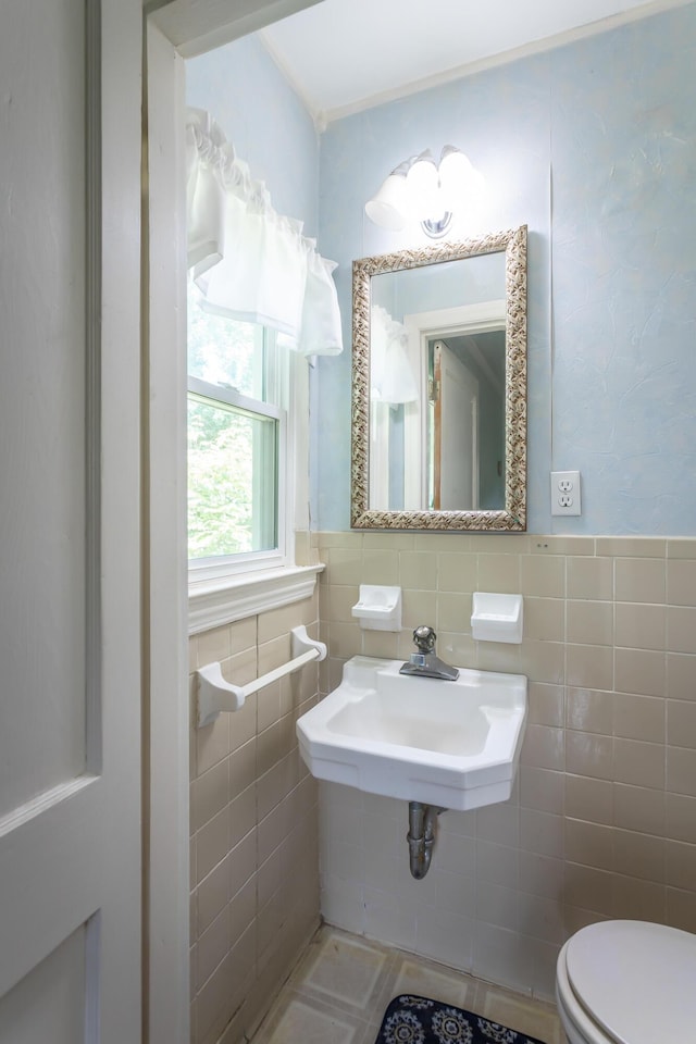 105 Joyce Ave, Red Bank, TN 37415 - half bath with tile walls, wainscoting, and tile patterned flooring