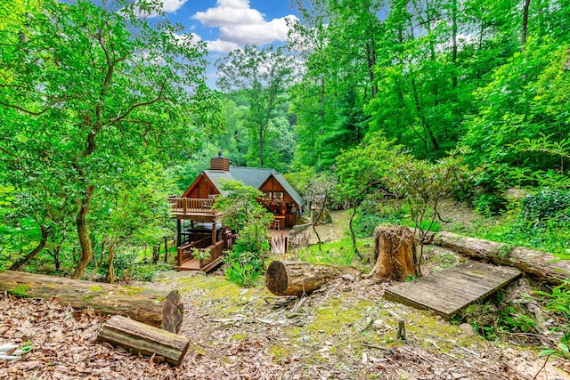 879 Amy Creek Cir, Ellijay, GA 30540 - view of yard featuring a wooden deck and a wooded view