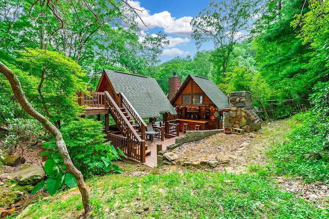 879 Amy Creek Cir, Ellijay, GA 30540 - back of house with a chimney, a wooden deck, roof with shingles, and stairway