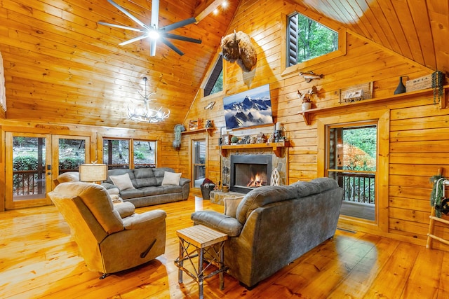 879 Amy Creek Cir, Ellijay, GA 30540 - living area featuring high vaulted ceiling, wooden walls, a stone fireplace, hardwood / wood-style flooring, and wooden ceiling