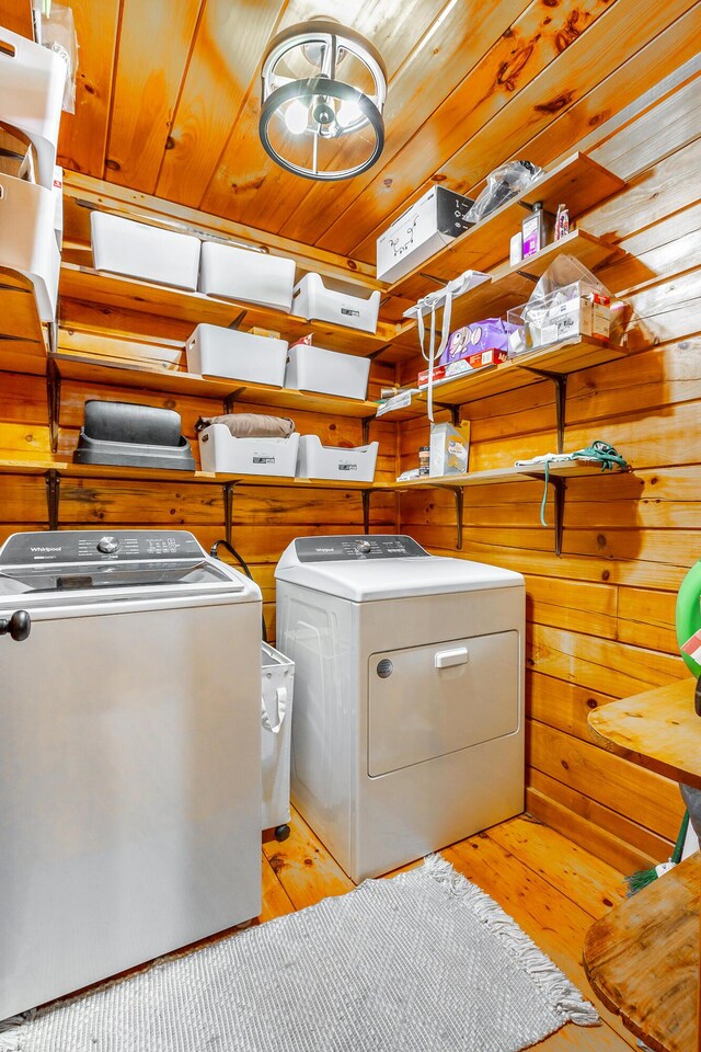 879 Amy Creek Cir, Ellijay, GA 30540 - washroom with independent washer and dryer, wood walls, and light wood-style flooring