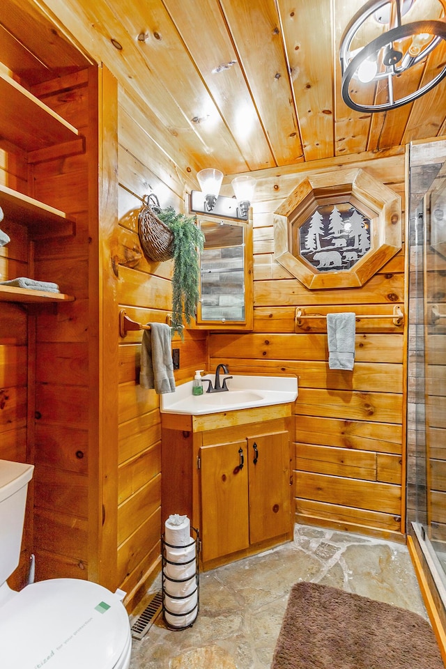 879 Amy Creek Cir, Ellijay, GA 30540 - bathroom featuring a stall shower, wood ceiling, vanity, wooden walls, and stone finish floors