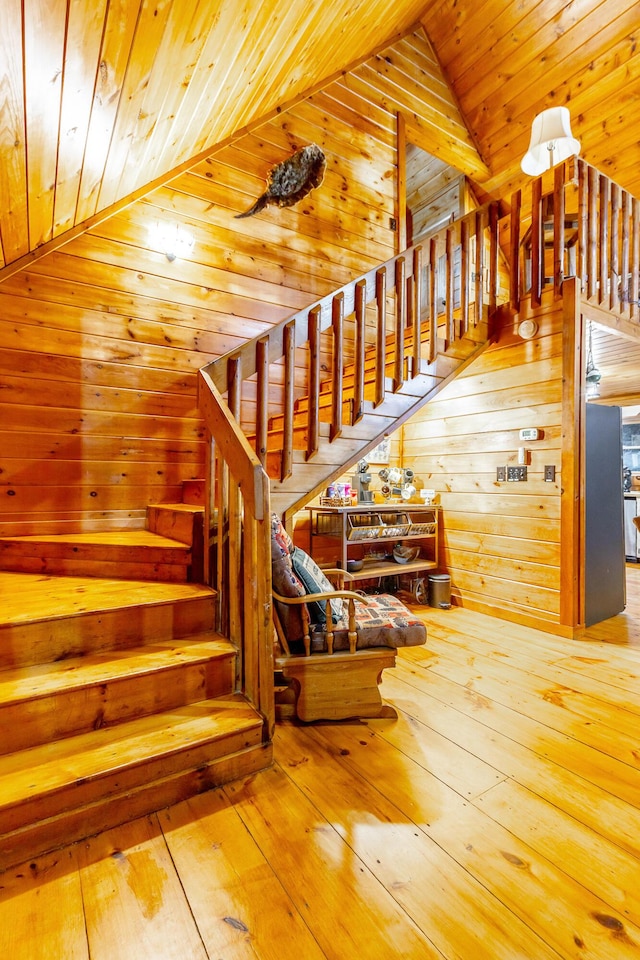 879 Amy Creek Cir, Ellijay, GA 30540 - stairway featuring wooden ceiling, wooden walls, hardwood / wood-style flooring, and vaulted ceiling
