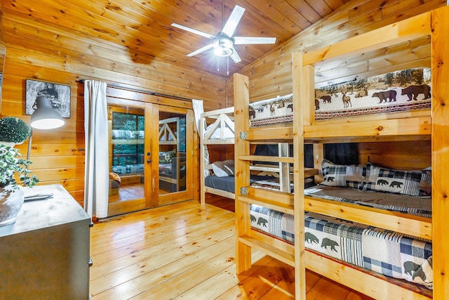 879 Amy Creek Cir, Ellijay, GA 30540 - bedroom featuring vaulted ceiling, french doors, wood walls, wood-type flooring, and wood ceiling