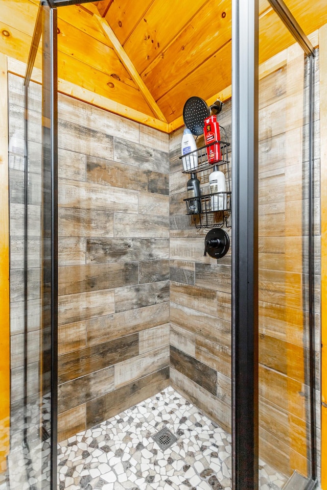 879 Amy Creek Cir, Ellijay, GA 30540 - bathroom with a stall shower, wood ceiling, lofted ceiling, and wood walls