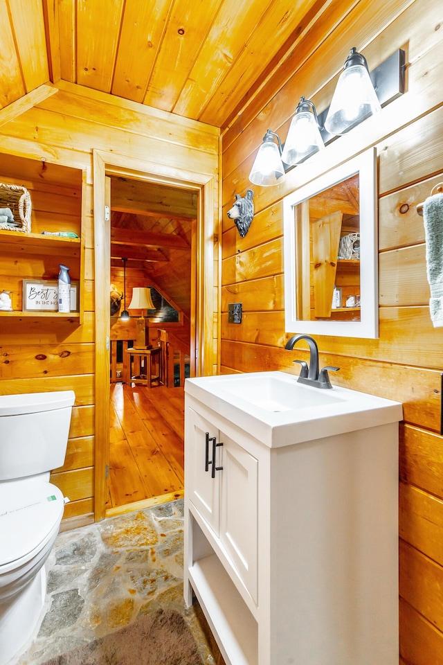 879 Amy Creek Cir, Ellijay, GA 30540 - half bath featuring wood ceiling, wood walls, vanity, and stone finish floors
