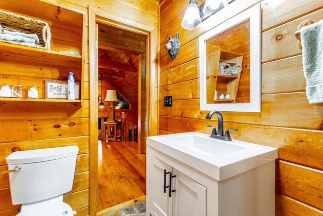 879 Amy Creek Cir, Ellijay, GA 30540 - bathroom with wood walls, vanity, hardwood / wood-style flooring, and vaulted ceiling