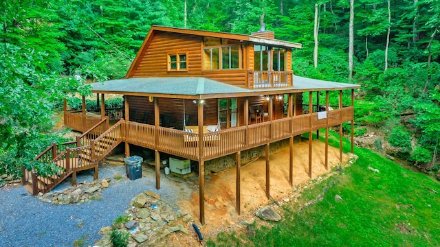 879 Amy Creek Cir, Ellijay, GA 30540 - back of property featuring a wooden deck, faux log siding, a chimney, and a shingled roof