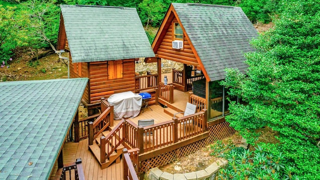 879 Amy Creek Cir, Ellijay, GA 30540 - wooden deck with a grill and a storage shed