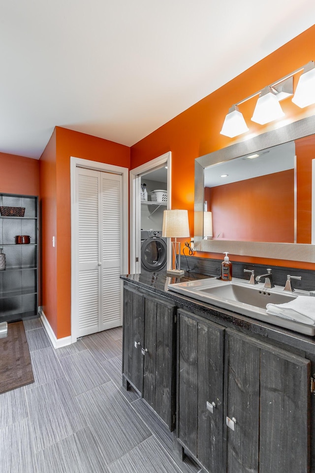 133 Wood Meadow Trl, Ringgold, GA 30736 - bathroom with washer / clothes dryer, double vanity, and a closet
