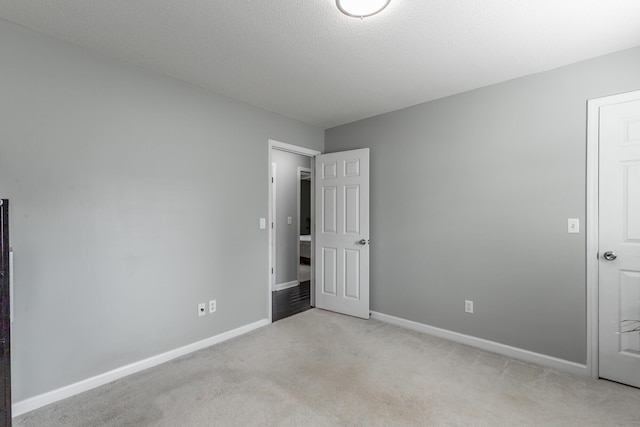 133 Wood Meadow Trl, Ringgold, GA 30736 - unfurnished bedroom featuring light carpet and baseboards
