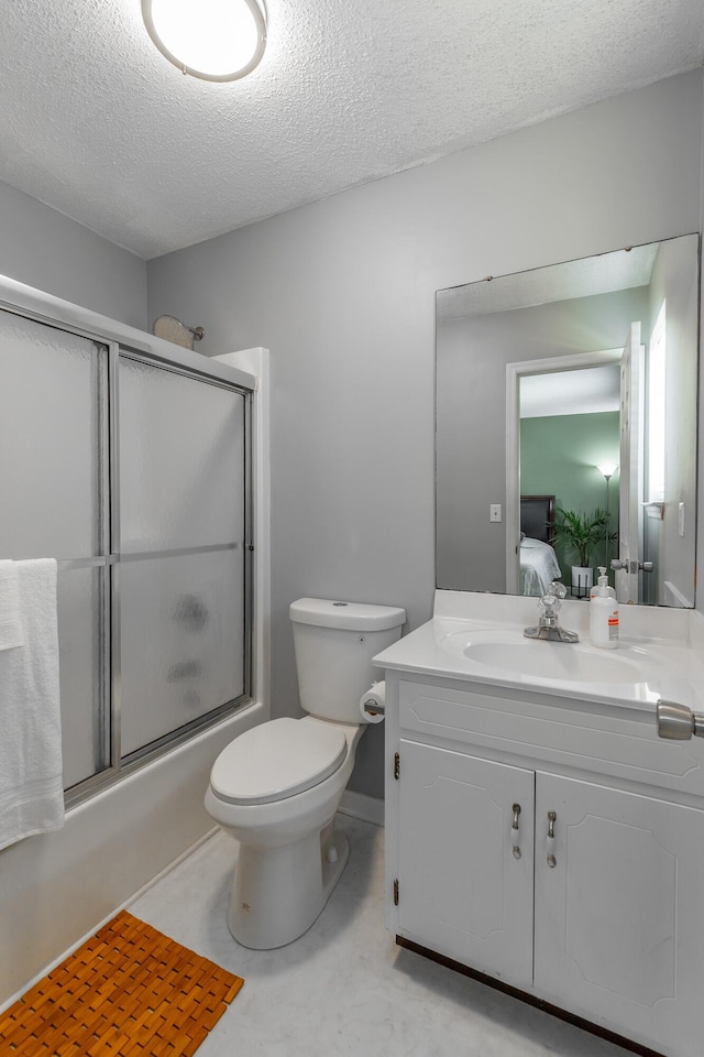 133 Wood Meadow Trl, Ringgold, GA 30736 - ensuite bathroom featuring vanity, enclosed tub / shower combo, and a textured ceiling