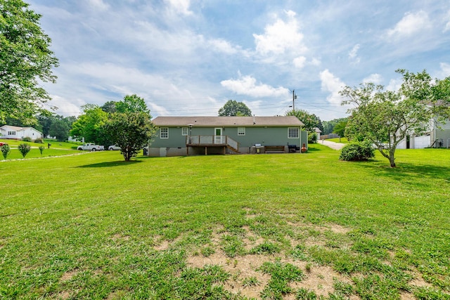 133 Wood Meadow Trl, Ringgold, GA 30736 - rear view of property with a deck and a lawn