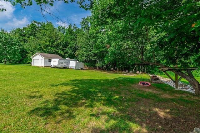 133 Wood Meadow Trl, Ringgold, GA 30736 - view of green lawn with an outbuilding and a detached garage