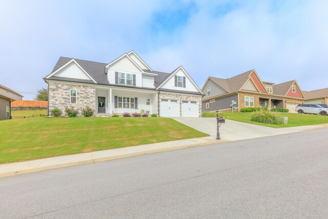 905 Live Oak Rd, Ringgold, GA 30736 - view of front facade featuring concrete driveway, stone siding, an attached garage, and board and batten siding