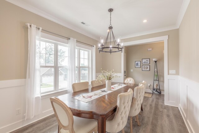 905 Live Oak Rd, Ringgold, GA 30736 - dining area featuring a chandelier, wood finished floors, ornamental molding, and a wainscoted wall