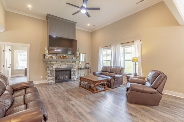 905 Live Oak Rd, Ringgold, GA 30736 - living area with a towering ceiling, a ceiling fan, wood finished floors, a fireplace, and ornamental molding