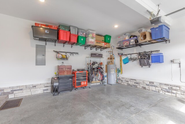 905 Live Oak Rd, Ringgold, GA 30736 - garage featuring water heater, electric panel, a garage door opener, and recessed lighting