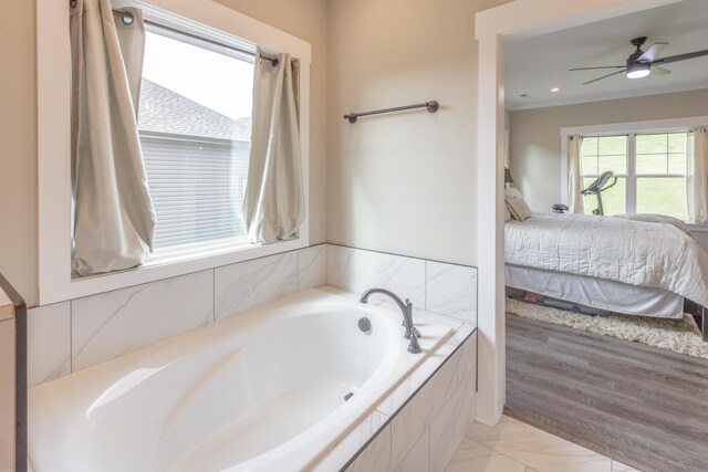 905 Live Oak Rd, Ringgold, GA 30736 - full bath with ensuite bath, a garden tub, marble finish floors, ceiling fan, and crown molding