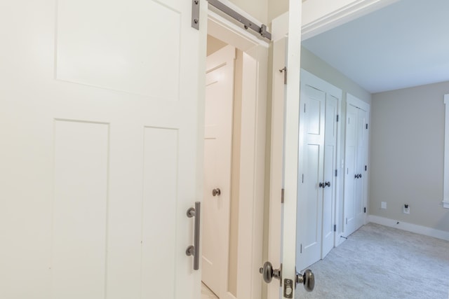 905 Live Oak Rd, Ringgold, GA 30736 - corridor featuring a barn door and light carpet