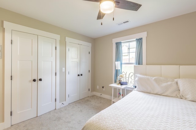 905 Live Oak Rd, Ringgold, GA 30736 - bedroom featuring light colored carpet, multiple closets, and a ceiling fan
