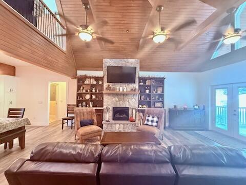 343 Highlands Forest Rd, Menlo, GA 30731 - living room featuring ceiling fan, wood ceiling, wood finished floors, high vaulted ceiling, and french doors