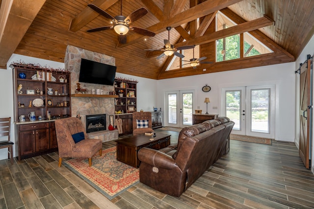 343 Highlands Forest Rd, Menlo, GA 30731 - living room with a wood ceiling with exposed beams, a ceiling fan, dark wood finished floors, a stone fireplace, and high vaulted ceiling