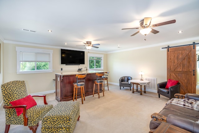 343 Highlands Forest Rd, Menlo, GA 30731 - living area with a barn door, crown molding, ceiling fan, bar with sink, and light colored carpet