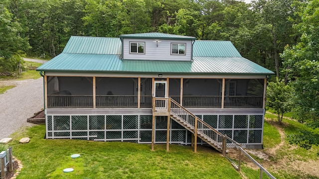 343 Highlands Forest Rd, Menlo, GA 30731 - back of property featuring a sunroom, a yard, a metal roof, stairway, and a wooded view