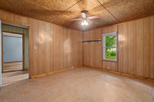 1815 City View St, Dalton, GA 30720 - spare room featuring ceiling fan and wooden walls