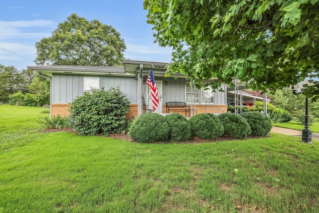 376 Pond Springs Rd, Chickamauga, GA 30707 - view of front of house featuring brick siding, a front yard, and board and batten siding