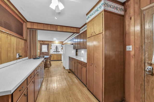 376 Pond Springs Rd, Chickamauga, GA 30707 - kitchen with freestanding refrigerator, light wood finished floors, light countertops, ceiling fan, and brown cabinets