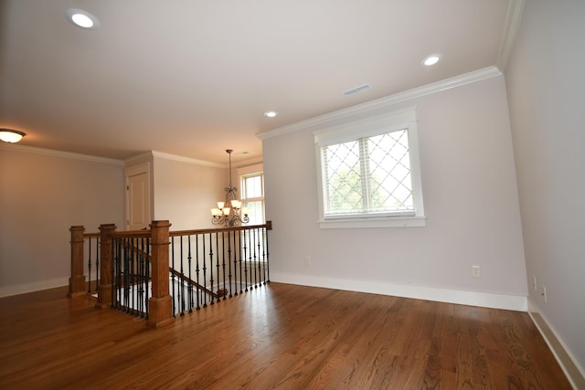 9532 Wandering Way, Ooltewah, TN 37363 - empty room with a chandelier, wood finished floors, crown molding, and recessed lighting