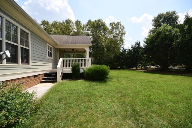 9532 Wandering Way, Ooltewah, TN 37363 - view of green lawn with ceiling fan and a porch