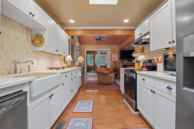 3412 Fairmount Pike, Signal Mountain, TN 37377 - kitchen with stainless steel appliances, tasteful backsplash, light wood-style flooring, white cabinets, and recessed lighting