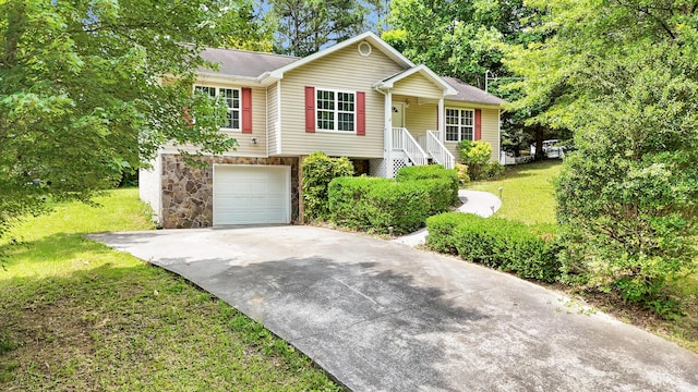 607 Gregory Ln, Lafayette, GA 30728 - view of front of property with stone siding, concrete driveway, a front lawn, and an attached garage