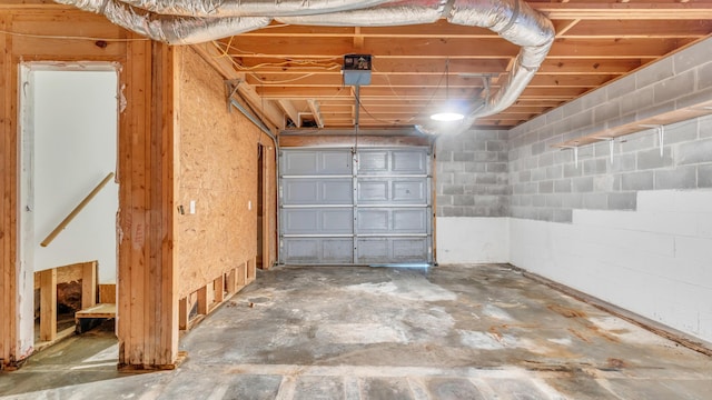 607 Gregory Ln, Lafayette, GA 30728 - garage with concrete block wall and a garage door opener