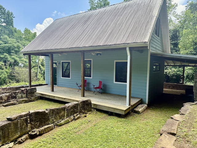 4019 W Rd, Signal Mountain, TN 37377 - rear view of house featuring a metal roof, a yard, and covered porch