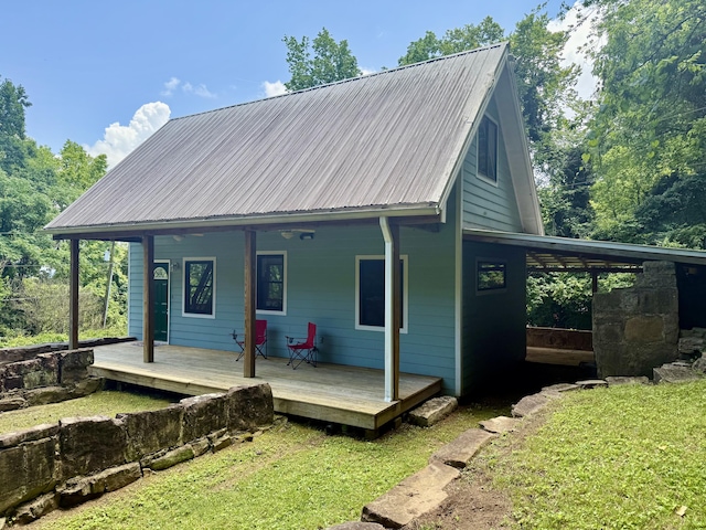 4019 W Rd, Signal Mountain, TN 37377 - back of property with a yard, a metal roof, and covered porch
