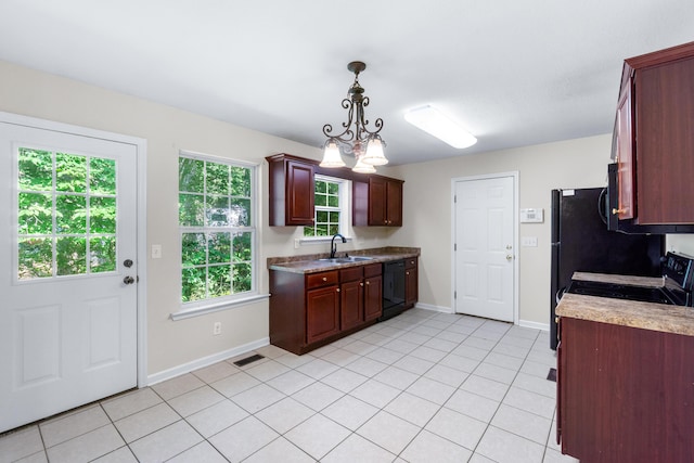 63 Apple Ln, Ringgold, GA 30736 - kitchen with black appliances, light tile patterned floors, light countertops, and dark brown cabinets