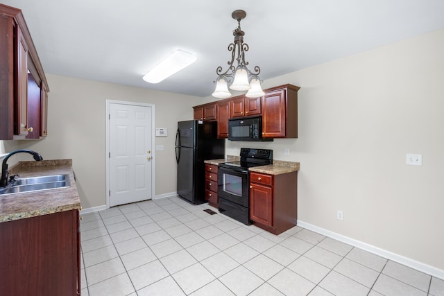 63 Apple Ln, Ringgold, GA 30736 - kitchen featuring black appliances, decorative light fixtures, light tile patterned floors, and dark brown cabinets