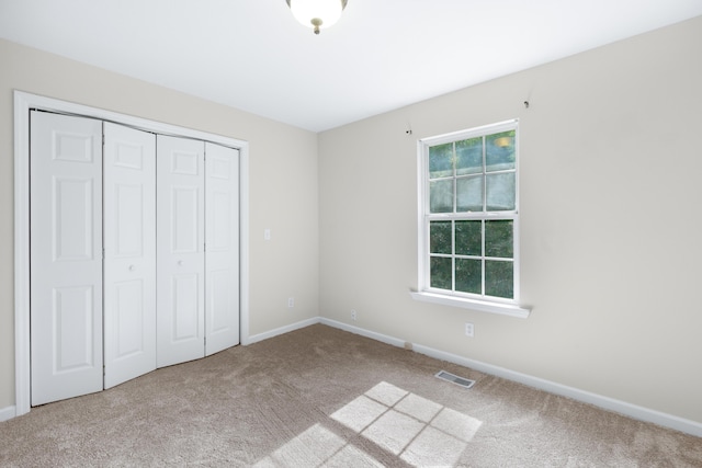 63 Apple Ln, Ringgold, GA 30736 - unfurnished bedroom featuring carpet flooring and a closet