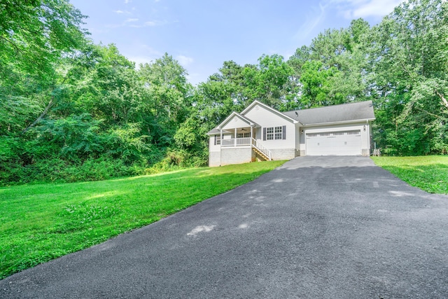 63 Apple Ln, Ringgold, GA 30736 - view of front of property featuring asphalt driveway, a garage, a front yard, covered porch, and stairway