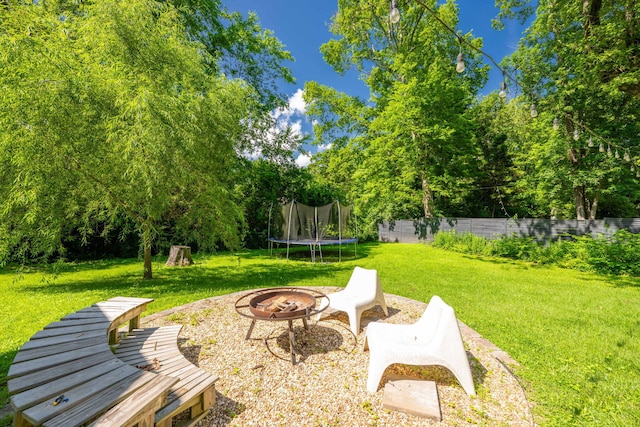 511 Georgia Ave, Signal Mountain, TN 37377 - view of yard with a trampoline, a fire pit, and view of scattered trees