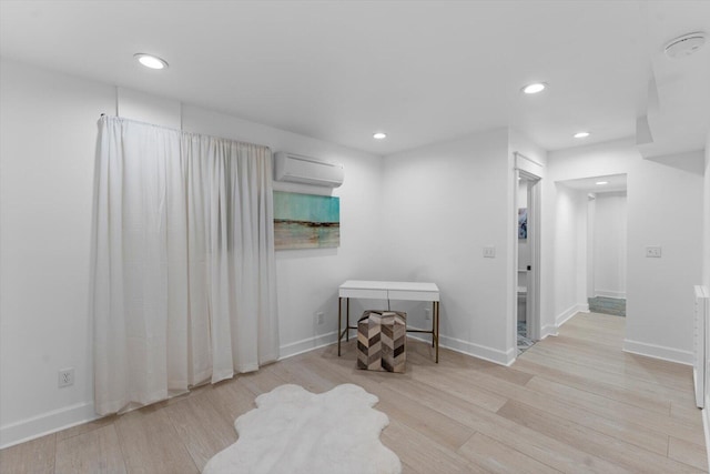 332 Oliver St, Chattanooga, TN 37405 - spare room with an AC wall unit, light wood finished floors, and recessed lighting
