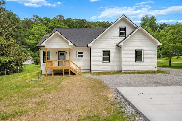 10822 Dallas Hollow Rd, Soddy Daisy, TN 37379 - view of front facade with a porch, roof with shingles, and a front lawn