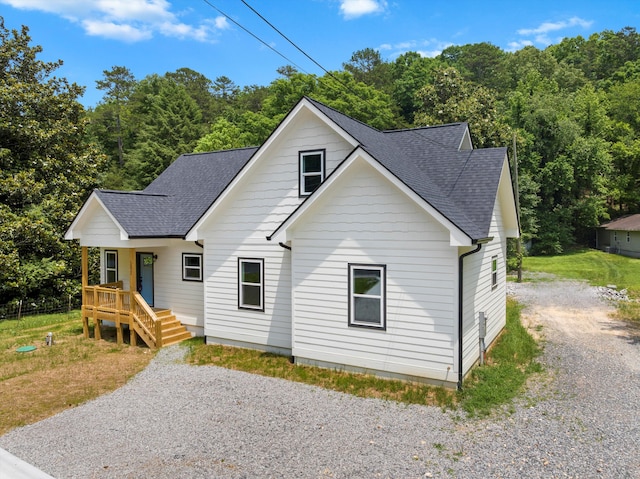 10822 Dallas Hollow Rd, Soddy Daisy, TN 37379 - view of front of house with roof with shingles, covered porch, and gravel driveway