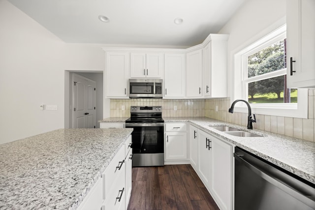 10822 Dallas Hollow Rd, Soddy Daisy, TN 37379 - kitchen with stainless steel appliances, decorative backsplash, white cabinetry, dark wood-type flooring, and recessed lighting