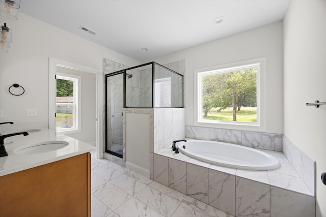 10822 Dallas Hollow Rd, Soddy Daisy, TN 37379 - bathroom with healthy amount of natural light, a garden tub, a stall shower, and recessed lighting